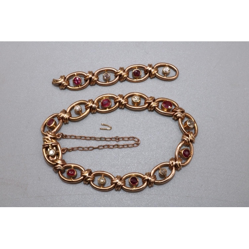 1020 - 15ct yellow gold oval link bracelet set with diamonds and rubies, with box closure and safety chain,... 
