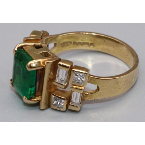 1003 - 18ct yellow gold diamond and emerald ring by Susan Wright, the central emerald cut emerald in claw s... 