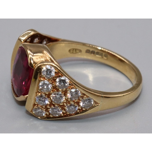 1006 - 18ct yellow gold diamond and ruby ring by Susan Wright, the central oval cut ruby in split bezel mou... 