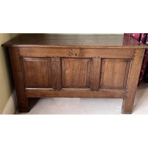 George III oak coffer, hinged plank top with moulded edge above four fielded panel front, carved with initials S.A., W126cm D50cm H78cm,