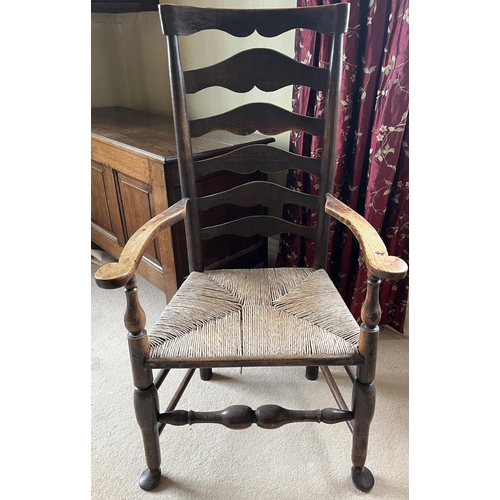 1352 - Early 19th century ash and elm Lancashire ladderback elbow chair, with shaped top rail, flattened cu... 