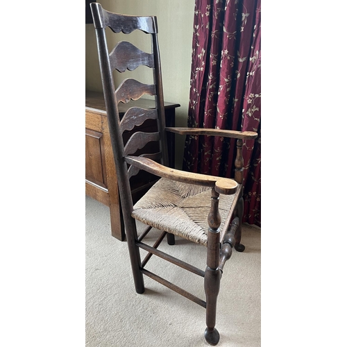 1352 - Early 19th century ash and elm Lancashire ladderback elbow chair, with shaped top rail, flattened cu... 