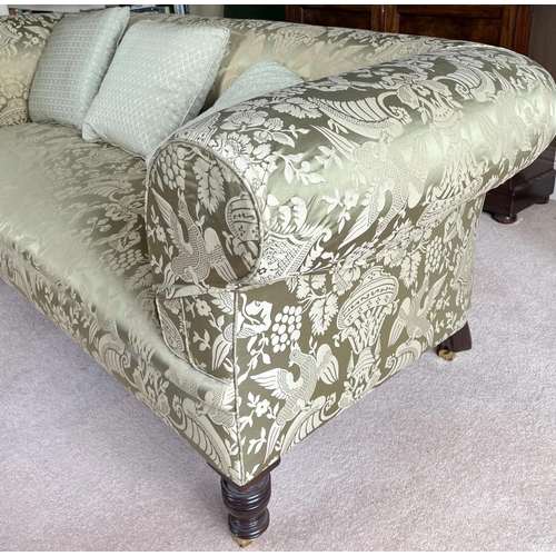 1320 - Victorian style Chesterfield sofa, with outsplayed arms on turned supports with brass sockets and ba... 