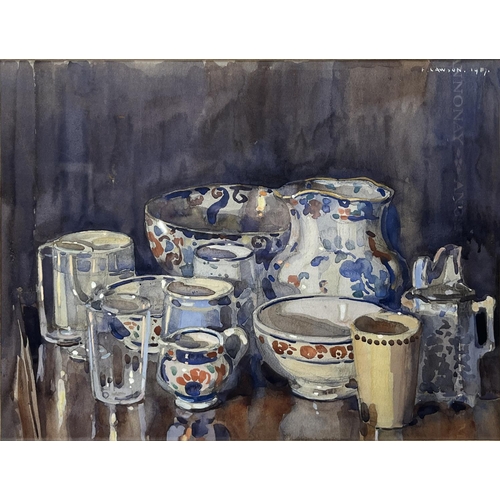 1253 - Frederick (Fred) Lawson (British 1888-1968); Staffordshire Pottery and glassware on a table, waterco... 