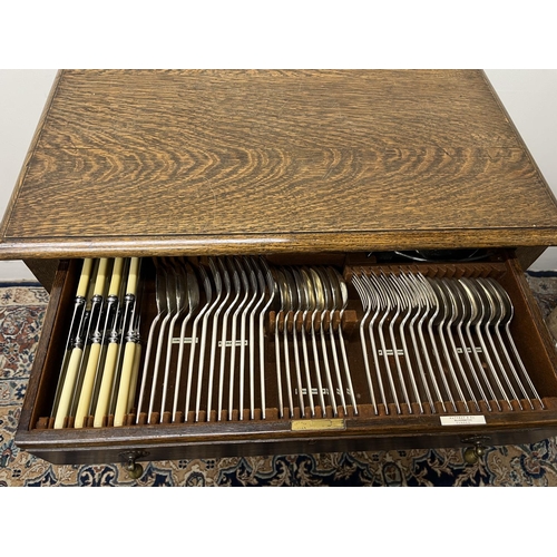 1053 - Canteen of EPNS cutlery for eight covers, with Art Deco angular handles, 58 pieces in oak single dra... 