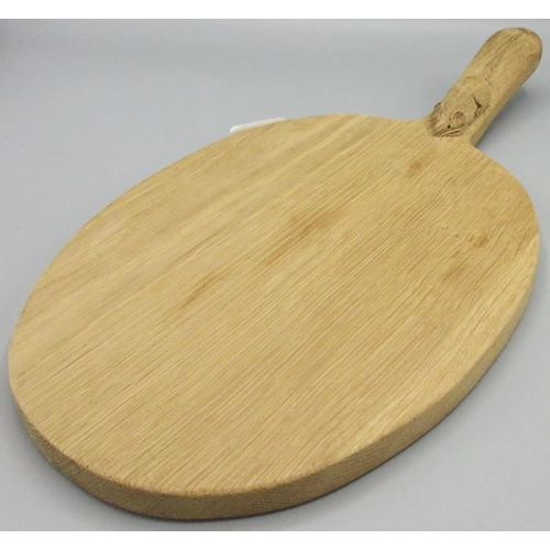 1376 - Robert Mouseman Thompson of Kilburn - an oak oval cheese board, curved handle carved with signature ... 