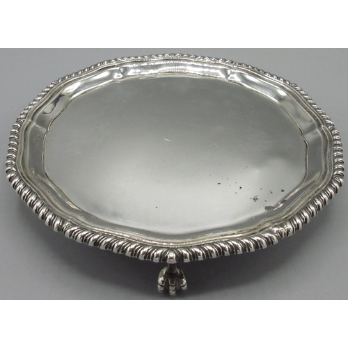 1047 - George V silver circular waiter, with gadrooned border on three claw and ball feet, Josiah Williams ... 