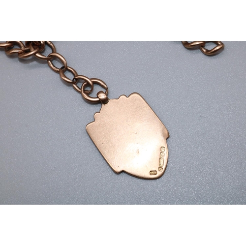 1005 - 9ct rose gold double Albert with attached 9ct gold shield fob, both stamped 375, 54.5g