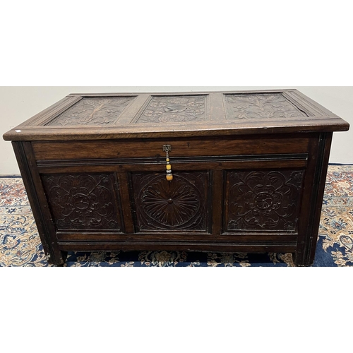 1336 - Small 18th century and later oak coffer, hinged top and front with three geometric and floral carved... 