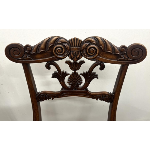 1344 - Pair of Regency rosewood side chairs, with anthemion leaf and scroll carved top rail and splat, cane... 