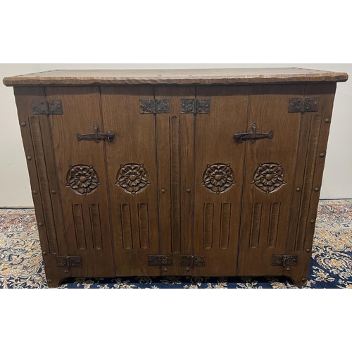 1373 - Jack Grimble of Cromer - an oak side cabinet, one piece top with shaped edge above two pairs of door... 