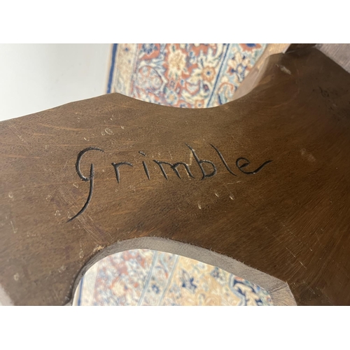 1377 - Jack Grimble of Cromer - an oak side table, one piece square top with shaped edge, on shaped solid o... 