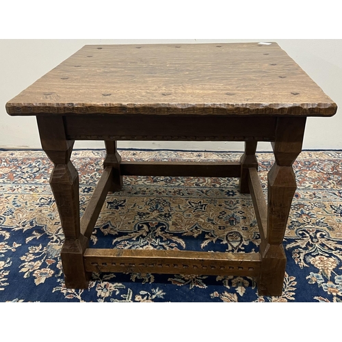 1378 - Jack Grimble of Cromer - an oak coffee table, one piece top with shaped edge on square baluster and ... 