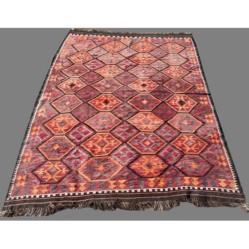 1290 - 20th century Kilim multi-coloured wool rug, central field with hexagonal repeating medallions, narro... 