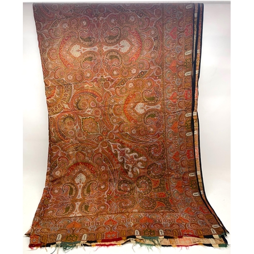 1287 - Victorian red ground polychrome Paisley shawl, traditional pattern in repeating border with fringe, ... 