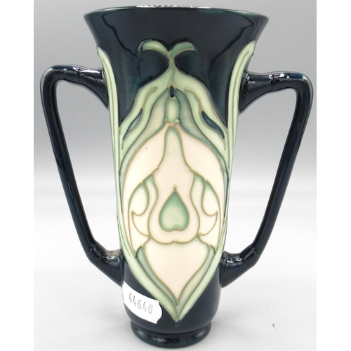 559 - Moorcroft Pottery: twin handled 'Snowdrop' pattern vase designed by Rachel Bishop for M.C.C, H15cm, ... 