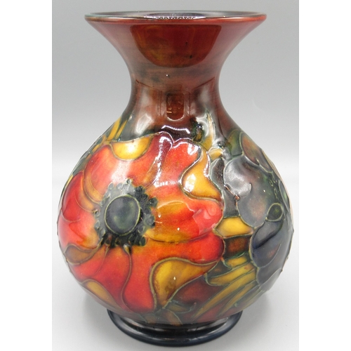 Moorcroft Pottery: 'Anemone' pattern vase globular vase with flared neck, red, green and blue flambe glaze, H13cm