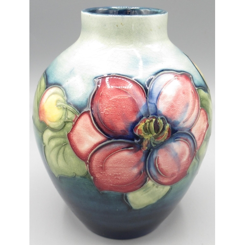 Moorcroft: 'Clematis' pattern ovoid vase, purple and pink flowers on graduated green ground, H13cm