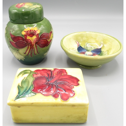 568 - Moorcroft Pottery: 'Hibiscus' pattern rectangular trinket box and cover, red flowers on yellow groun... 