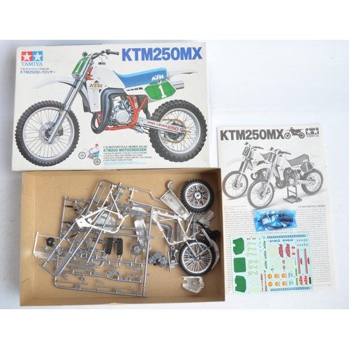 70 - Four 1/12 scale plastic model motorcycle kits from Tamiya to include 1451 KTM250MX with motocross ri... 