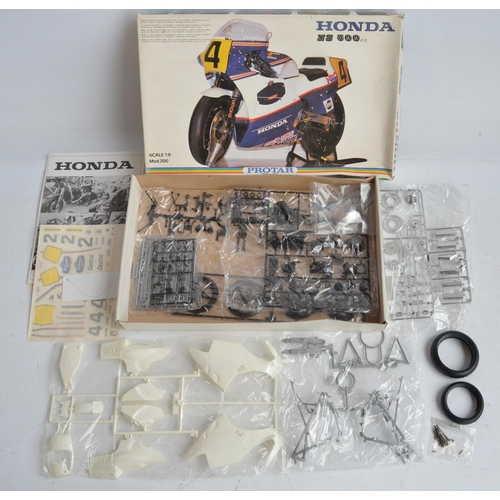 96 - Three unbuilt 1/9 scale plastic Honda NS500 motorbike model kits from Protar. Kits appear complete w... 