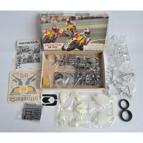 96 - Three unbuilt 1/9 scale plastic Honda NS500 motorbike model kits from Protar. Kits appear complete w... 