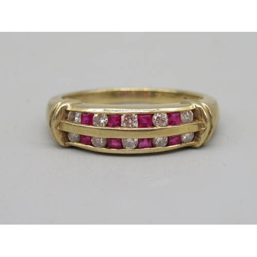 13 - 9ct yellow gold ring set with two rows of alternating square cut rubies and brilliant cut diamonds, ... 