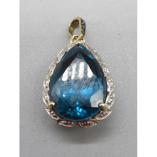 210 - 9ct yellow gold London blue topaz and blue diamond pendant, limited edition 1/50, 4.6g