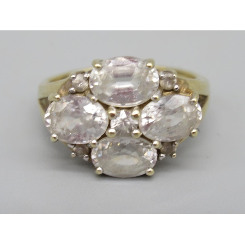 10 - 9ct yellow gold ring set with white sapphires, four oval cut and five brilliant cut white sapphires,... 