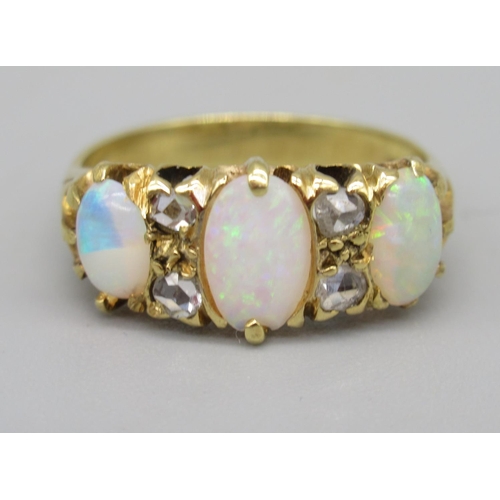 9 - 18ct yellow gold opal and diamond ring, the three cabochon opals separated by brilliant cut diamonds... 