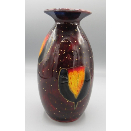 1003 - Anita Harris art pottery, minos vase with stylised flowers on a maroon ground, covered in gold speck... 