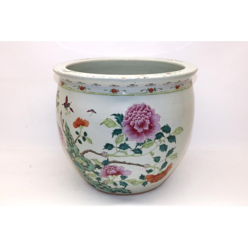 331 - Large Chinese famille rose fish bowl jardiniere decorated with peonies, H32cm, A/F