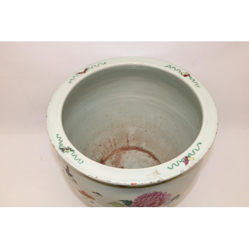 331 - Large Chinese famille rose fish bowl jardiniere decorated with peonies, H32cm, A/F