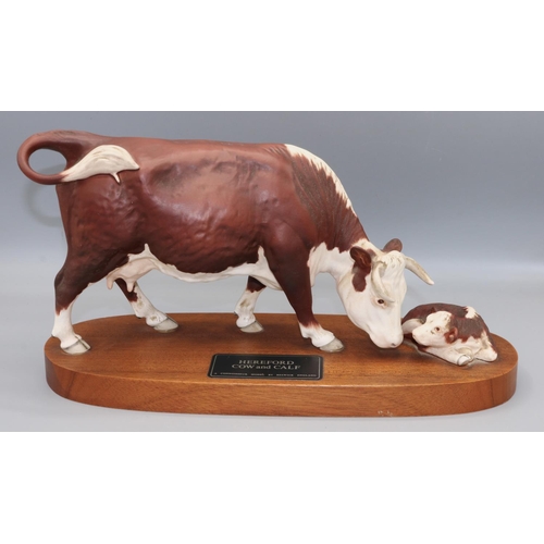 362 - Beswick Connoisseur model: Hereford Cow and Calf, mounted on wooden plinth, L33cm