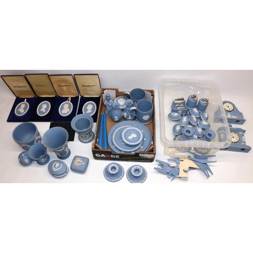 382 - Large collection of Wedgwood blue jasperware incl. two clocks, two pairs of candlesticks, four table... 