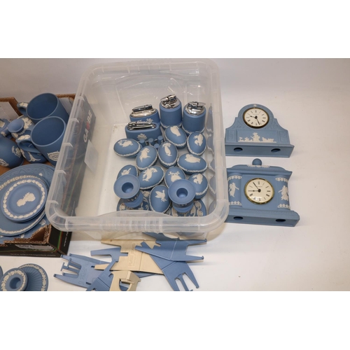 382 - Large collection of Wedgwood blue jasperware incl. two clocks, two pairs of candlesticks, four table... 