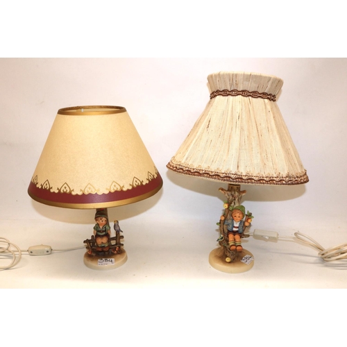 384 - Hummel Goebel, two table lamps, 'Apple Tree Boy' and 'Wayside Harmony'