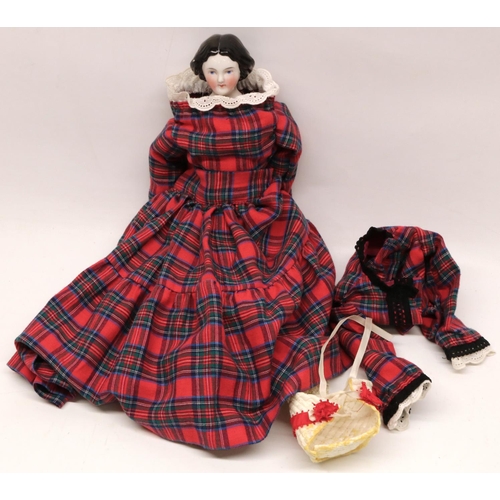 400 - Reproduction 19th century style porcelain head doll, moulded and black painted hair, tartan costume,... 