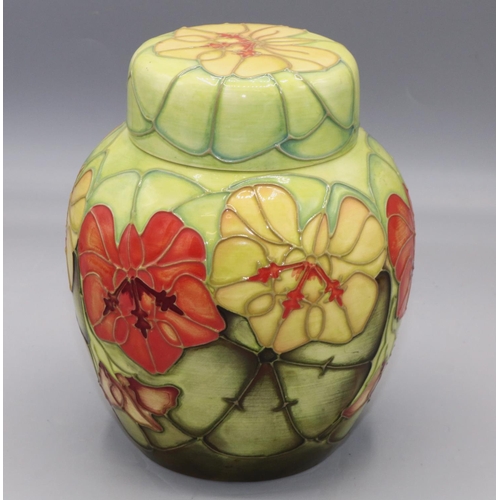 Moorcroft Pottery: 'Nasturtium' pattern ginger jar designed by Sally Tuffin for M.C.C., orange and yellow flowers on lime green ground, H15.5cm