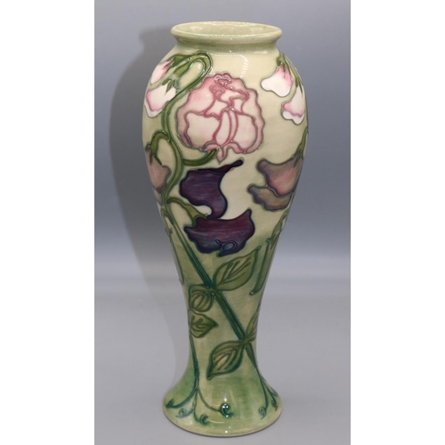 Moorcroft Pottery: 'Sweet Pea' vase designed by Sally Tuffin for M.C.C. c1992, pink and purple flowers on graduated green ground, H27.5cm