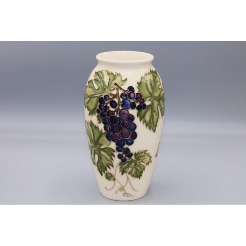 560 - Moorcroft Pottery: 'Grapevine' vase designed by Sally Tuffin for M.C.C. c1987, purple grapes on crea... 