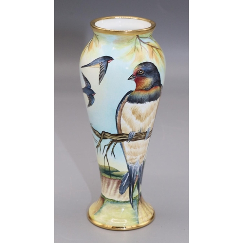 569 - Moorcroft Pottery: miniature enamel decorated vase, painted decoration of swallows above fields, H10... 