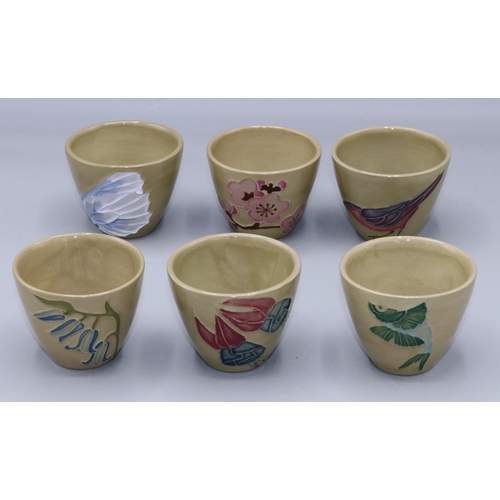 570 - Moorcroft Pottery: set of six sake cups,
each with varying tubelined decoration, green ground, H4.5c... 