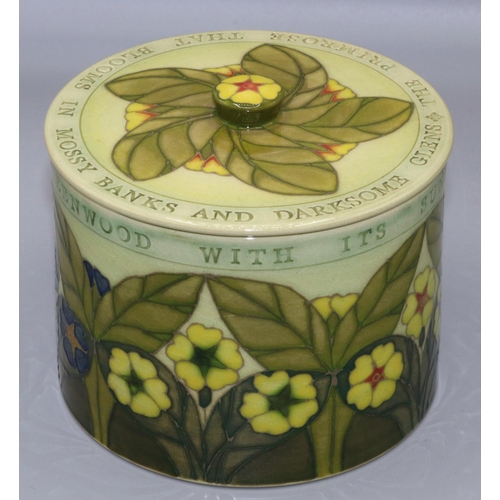 572 - Dennis Chinaworks, circular box and cover decorated with text and primroses, D13cm