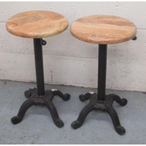 180 - C20th pair of cast iron machinist type stools with circular beech height adjustable seats, minimum H... 