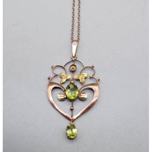 231 - 9ct rose gold peridot pendant on a rose metal chain, 45cm, 3.7g