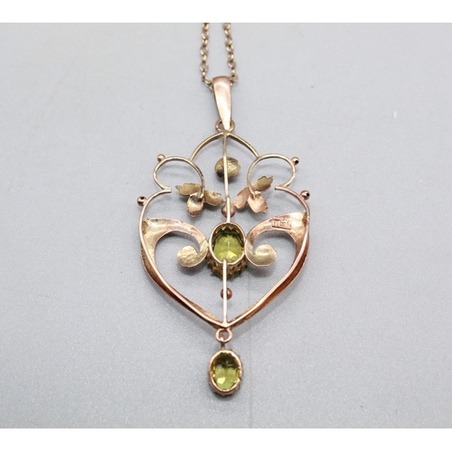 231 - 9ct rose gold peridot pendant on a rose metal chain, 45cm, 3.7g