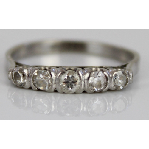 104 - White metal five stone diamond ring, the round cut diamonds in rub-over settings, on plain  shank, n... 