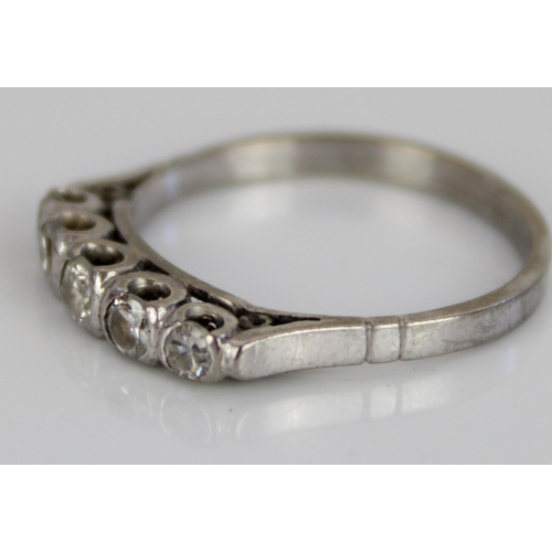 104 - White metal five stone diamond ring, the round cut diamonds in rub-over settings, on plain  shank, n... 