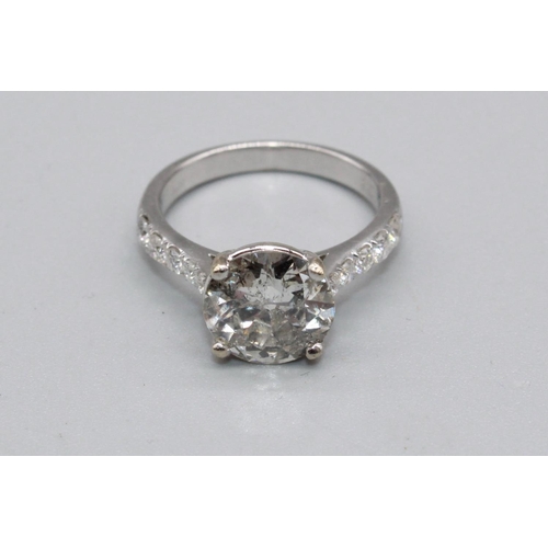 18ct white gold diamond solitaire ring, the brilliant cut diamond, approx. weight 3.50ct, in claw mount on diamond set shoulders, stamped 750, size N1/2, 5.1g

With independent diamond grading laboratories certificate